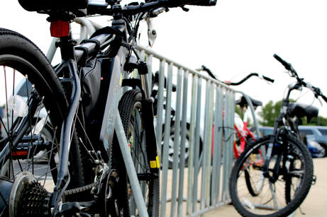 A photograph of bicycles on a bike rack. September 2024.
